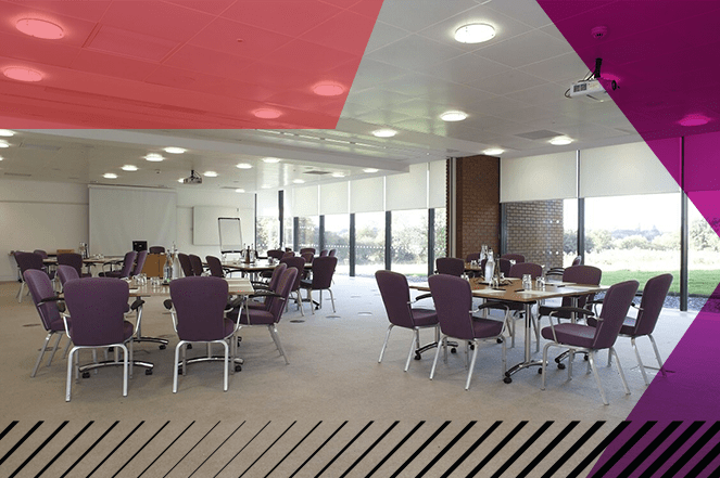Large staff workshop space available at Woodland Grange, with tables and chairs positioned in an informal formation.