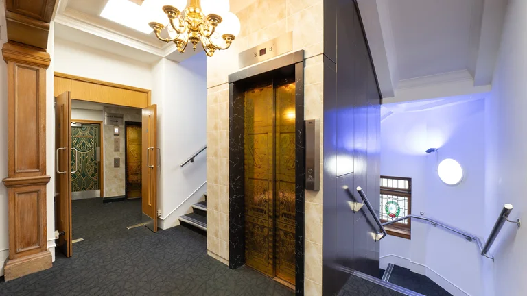Art Deco design corridor with a lift and stairs