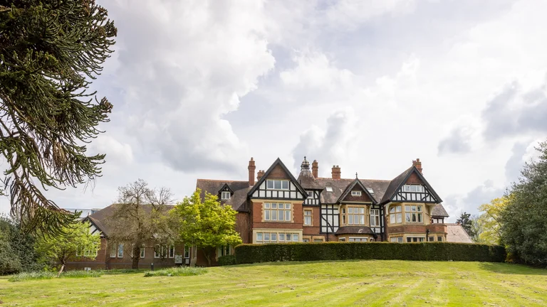 Woodland Grange Tudor building venue with garden and trees 