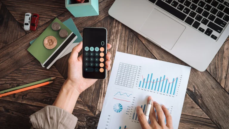Person working out the cost of their event using a calculator.